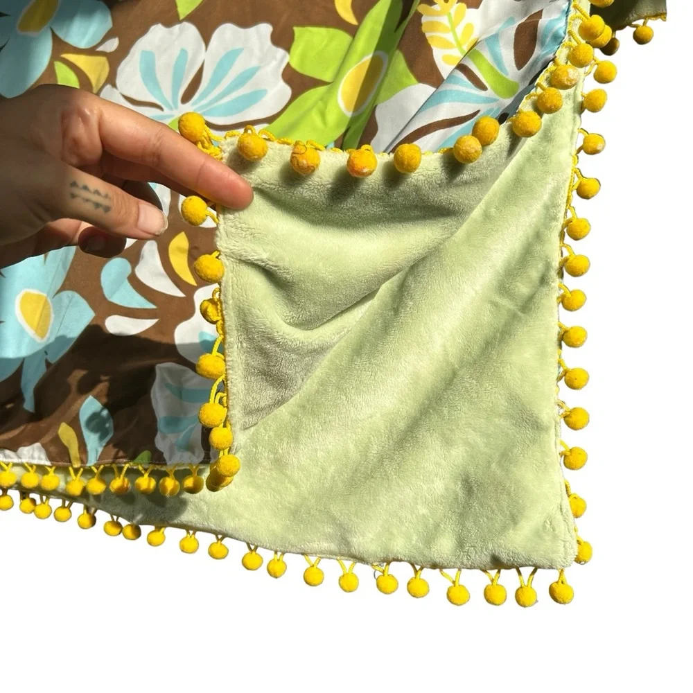 Green aloha print beach blanket